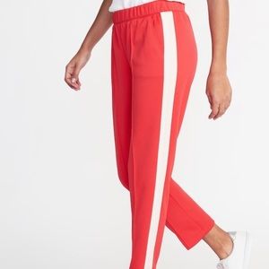 Red sporty pants with white & pink stripes